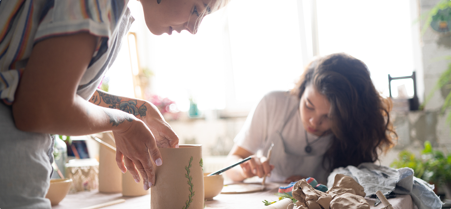 group photo of working on pottery wheel